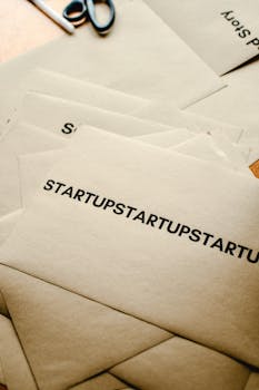 Brown paper envelopes featuring startup text, symbolizing business innovation and entrepreneurship.